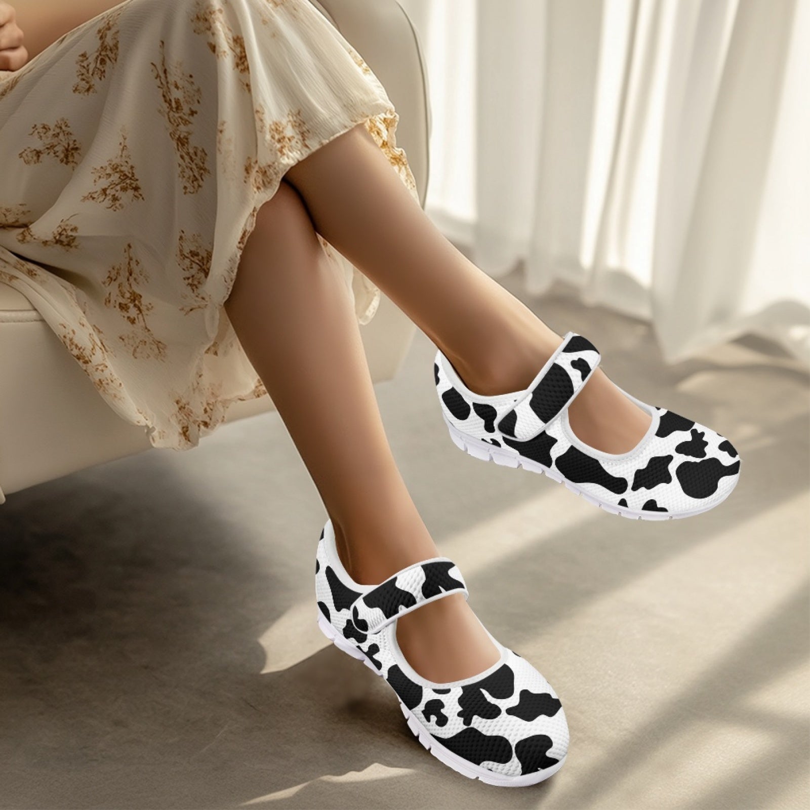 cow print shoes indoors with a light background